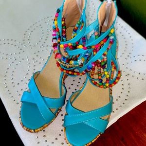 Beautiful turquoise strap zip up wedges